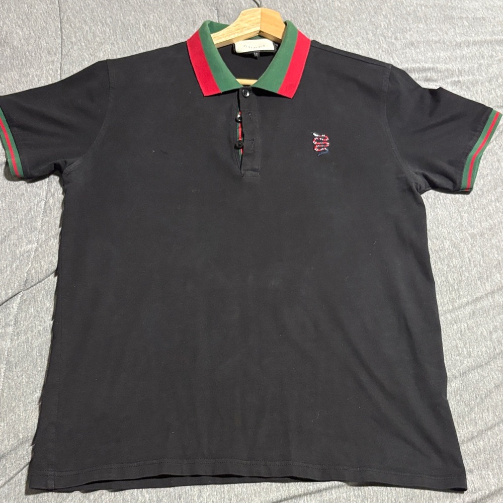 Black Polo Shirt with Red and Green Accents